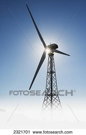 Stock Image - Sunlight Illuminating A Wind Turbine; Tarifa Cadiz Andalusia Spain. Fotosearch