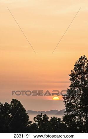 Sunrise as seen from the overlook along the foothills parkway great smoky mountains national park; Tennessee united states of america View Large Photo Image Stock Image - Sunrise as seen from the overlook along the foothills parkway great smoky mountains national park; Tennessee united states of america. Fotosearch