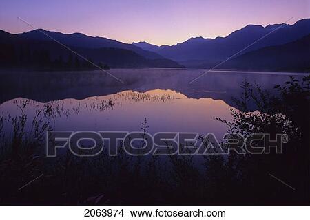 Picture - Sunrise Glows Purple In The Reflection, Green Lake, Whistler, Bc. Fotosearch