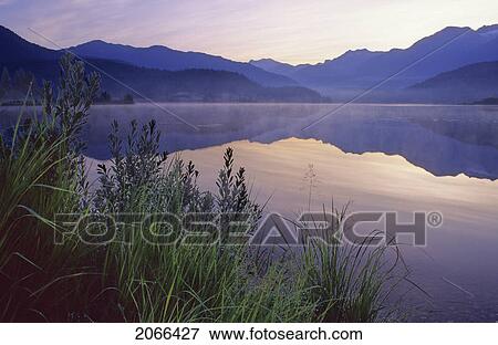 Sunrise Glows Purple In The Reflection, Green Lake, Whistler, Bc View Large Photo Image Stock Photo - Sunrise Glows Purple In The Reflection, Green Lake, Whistler, Bc. Fotosearch