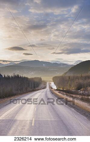 Picture - Sunrise over the alaska highway west of fort nelson in the canadian rockies in early spring; British columbia canada. Fotosearch