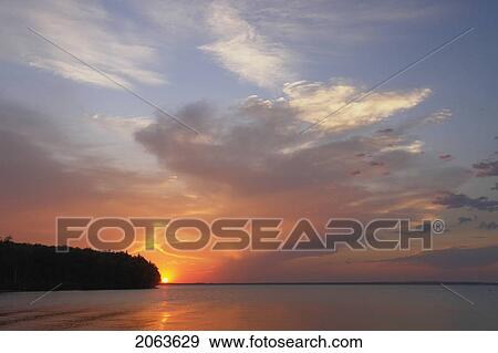 Sunset Clear Lake; Canada, Manitoba, Riding Mountain National Park View Large Photo Image Stock Photo - Sunset Clear Lake; Canada, Manitoba, Riding Mountain National Park. Fotosearch