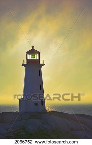 Stock Image - Sunset Over Peggy's Cove Lighthouse.. Fotosearch
