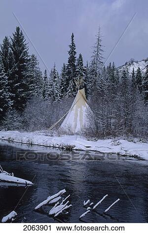 Stock Image - Teepee Stands By Small River, Early Winter, Whistler, Bc. Fotosearch