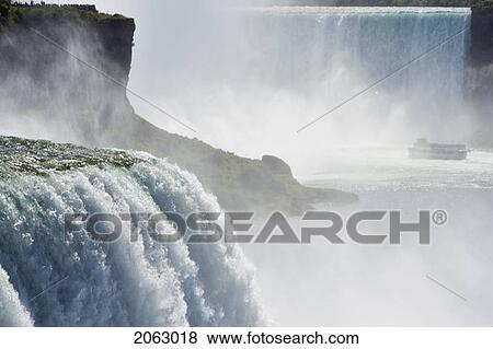 Stock Photo - The American Falls From Prospect Point (Niagara Falls State Park - Niagara Falls New York Usa) With Horseshoe Falls And The 'maid Of The Mist' In The Background, Usa, New York. Fotosearch