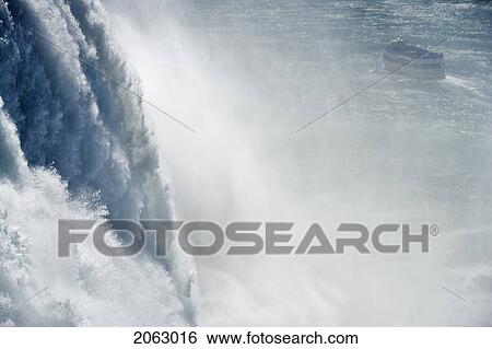 Stock Photograph - The American Falls Photographed From Prospect Point - Niagara Falls State Park - Niagara Falls New York Usa With The Maid Of The Mist In The Background, Usa, New York, Niagara Falls. Fotosearch