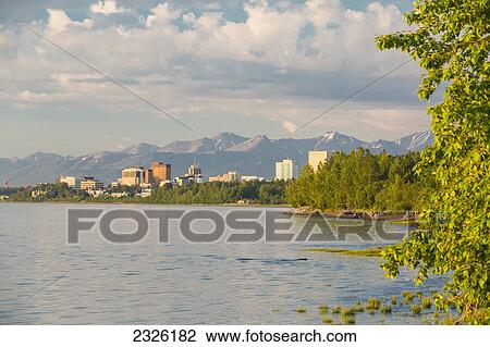 The anchorage city skyline seen from the tony knowles coastal trail during high tide chugach mountains in the background; Anchorage alaska united states of america View Large Photo Image Stock Image - The anchorage city skyline seen from the tony knowles coastal trail during high tide chugach mountains in the background; Anchorage alaska united states of america. Fotosearch