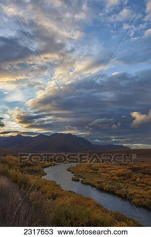 The Blackstone River Flows Through The Colourful Tundra At Sunset Along The Dempster Highway; Yukon Canada View Large Photo Image Stock Image - The Blackstone River Flows Through The Colourful Tundra At Sunset Along The Dempster Highway; Yukon Canada. Fotosearch
