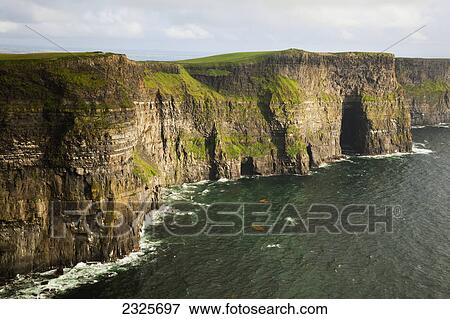 Stock Photo - The cliffs of moher along the coastline near doolin; County clare ireland. Fotosearch