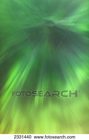 The green northern lights corona in the sky above the tony knowles coastal trail in winter at nighttime; Anchorage alaska united states of america View Large Photo Image Stock Image - The green northern lights corona in the sky above the tony knowles coastal trail in winter at nighttime; Anchorage alaska united states of america. Fotosearch