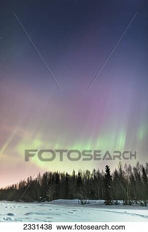 The northern lights in the sky above the tony knowles coastal trail in winter at nighttime; Anchorage alaska united states of america View Large Photo Image Stock Photo - The northern lights in the sky above the tony knowles coastal trail in winter at nighttime; Anchorage alaska united states of america. Fotosearch