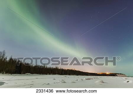 The northern lights in the sky above the tony knowles coastal trail and point woronzof in winter at nighttime; Anchorage alaska united states of america View Large Photo Image Stock Photograph - The northern lights in the sky above the tony knowles coastal trail and point woronzof in winter at nighttime; Anchorage alaska united states of america. Fotosearch