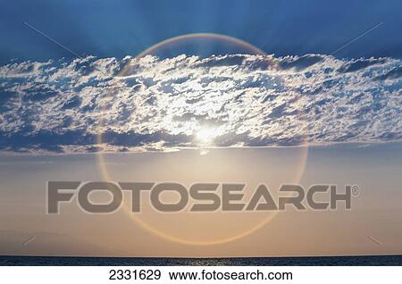 The setting sun creates a sundog; Puerta vallarta mexico View Large Photo Image Stock Photo - The setting sun creates a sundog; Puerta vallarta mexico. Fotosearch