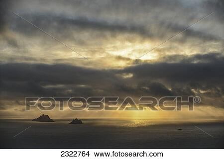 Picture - The skellig islands viewed from bolus head at sunset; Iveragh peninsula county kerry ireland. Fotosearch