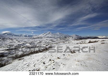 Stock Image - The View Near The Haines Summit Along The Haines Highway Where Fresh Snow Has Fallen; British Columbia Canada. Fotosearch