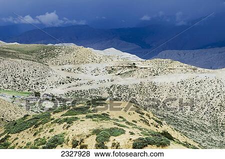 Thunderstorm cloud above a mountain nepalese village; Upper mustang nepal View Large Photo Image Stock Photo - Thunderstorm cloud above a mountain nepalese village; Upper mustang nepal. Fotosearch