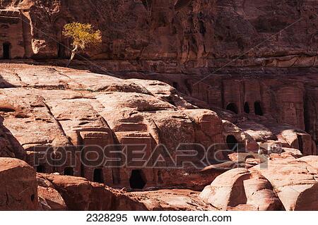 Stock Photography - Tombs in the rock in an ancient city; Petra jordan. Fotosearch