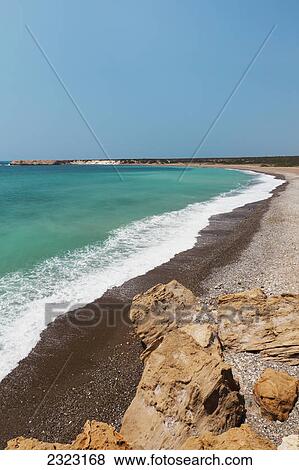 Turquoise ocean water coming into shore along a beach; Akamas peninsula cyprus View Large Photo Image Stock Photo - Turquoise ocean water coming into shore along a beach; Akamas peninsula cyprus. Fotosearch