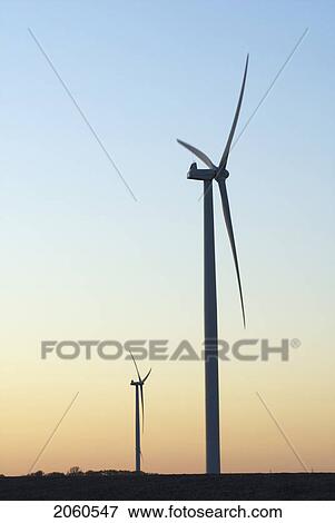 Stock Photo - Two Wind Turbines At Sunset. Fotosearch
