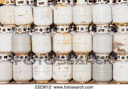 Stock Image - Used propane tanks piled up for recycling; Edmonton alberta canada. Fotosearch