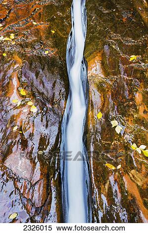 Stock Photography - Utah, Zion National Park, Flowing water in Stone Rivet along the Subway Trail.. Fotosearch