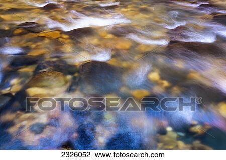 Stock Image - Utah, Zion National Park, Virgin River, Flowing river, Canyon narrows.. Fotosearch