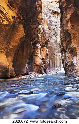 Stock Image - Utah, Zion National Park, Virgin River, Long exposure of flowing river.. Fotosearch