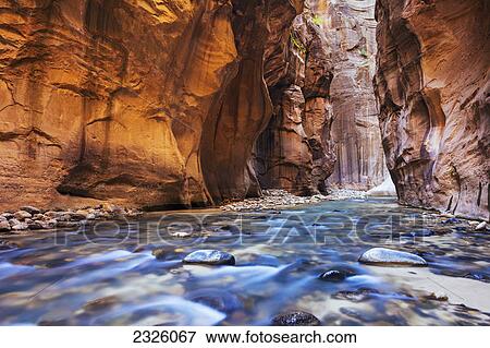 Stock Photo - Utah, Zion National Park, Virgin River, Long exposure of flowing river, Canyon narrows.. Fotosearch