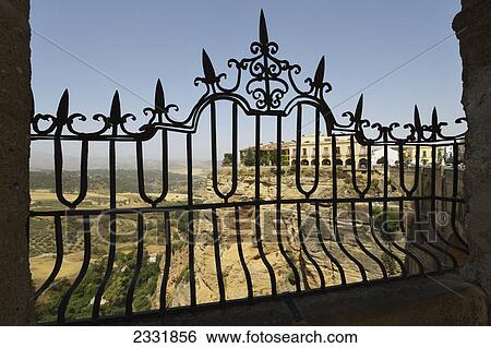 View from new bridge across the tajo gorge to the parador; Ronda malaga andalusia spain View Large Photo Image Stock Photograph - View from new bridge across the tajo gorge to the parador; Ronda malaga andalusia spain. Fotosearch