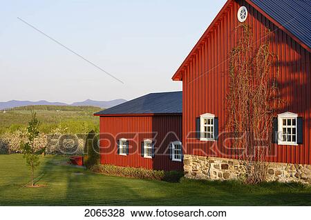 Stock Photo - View Of Barn, Apple Orchard In Bloom And Jay Peak In Vermont (Center) At Sunset, Eastern Townships, Quebec, Canada.. Fotosearch
