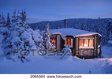 Picture - View Of La Mesange Shelter And Snow-Covered Trees At Twilight, Quebec, Canada. Fotosearch