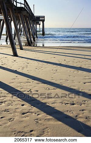 Stock Photo - View Of Pier And Beach At Sunrise, New Jersy, Usa. Fotosearch