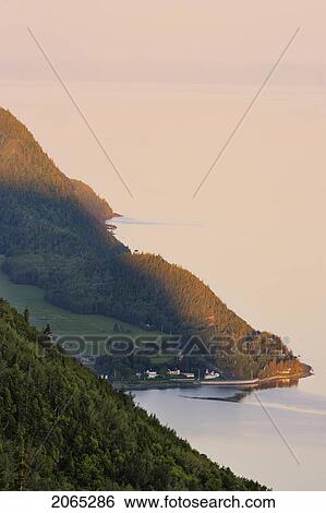 Stock Photograph - View Of Saint-Fabien-Sur-Mer And St. Lawrence River At Sunrise.. Fotosearch