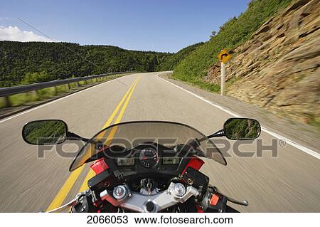 Stock Image - View On Motorcycle In Action On Cabot Trail, Cape Breton Highlands National Park, Nova Scotia, Canada. Fotosearch