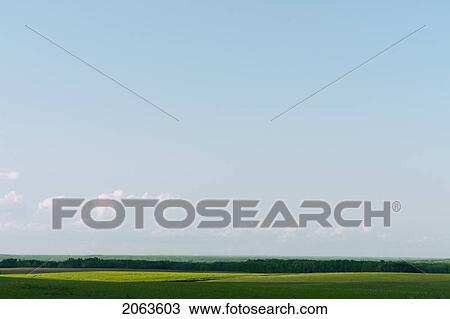 Vista Of Green Fields And Distant Hills; Canada, Manitoba, Erickson View Large Photo Image Stock Image - Vista Of Green Fields And Distant Hills; Canada, Manitoba, Erickson. Fotosearch