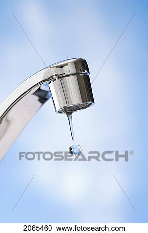 Stock Image - Water Drips From Kitchen Tap.. Fotosearch