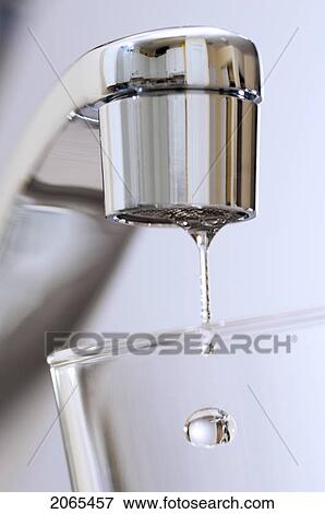Water Drips From Kitchen Tap. View Large Photo Image Stock Photo - Water Drips From Kitchen Tap.. Fotosearch