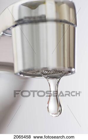 Water Drips From Kitchen Tap. View Large Photo Image Stock Photo - Water Drips From Kitchen Tap.. Fotosearch