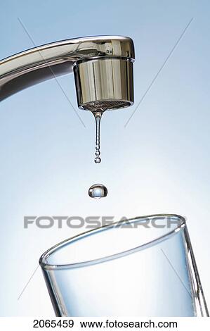 Water Drips From Kitchen Tap. View Large Photo Image Stock Photo - Water Drips From Kitchen Tap.. Fotosearch