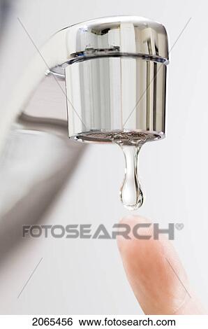 Water Drips From Kitchen Tap. View Large Photo Image Stock Photograph - Water Drips From Kitchen Tap.. Fotosearch