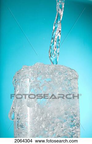 Water Pouring Into Overflowing Glass View Large Photo Image Picture - Water Pouring Into Overflowing Glass. Fotosearch