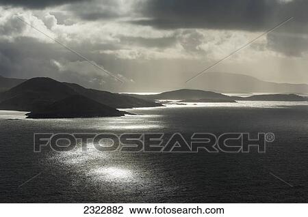 Stock Image - Weather moving across ballinskelligs bay; Iveragh peninsula county kerry ireland. Fotosearch