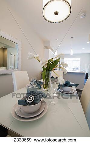 White dishes set on a white table in a kitchen; Surrey, British Columbia, Canada View Large Photo Image Stock Photo - White dishes set on a white table in a kitchen; Surrey, British Columbia, Canada. Fotosearch