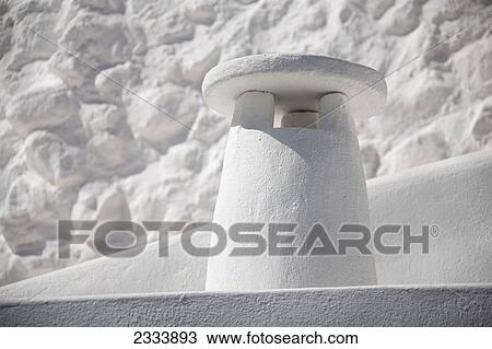 Stock Image - White-in-white cycladic chimney on Santorini Island; Imerovigli, Cyclades, Greece. Fotosearch