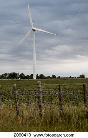 Stock Image - Wind Turbine Beyond Wire Fence, Tiverton, Bruce Peninsula, Ontario. Fotosearch