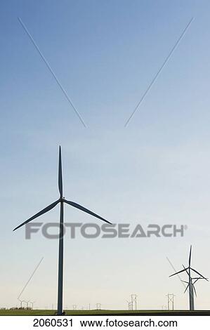 Stock Image - Wind Turbines And Hydroelectric Towers. Fotosearch