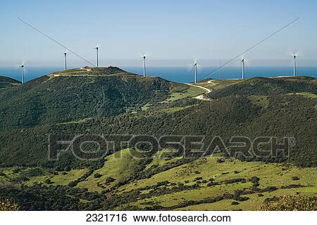 Stock Photograph - Wind Turbines In A Row Along The Water's Edge; Tarifa Cadiz Andalusia Spain. Fotosearch