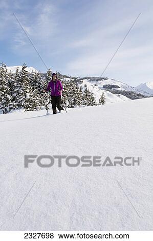 Woman snowshoeing on a sunny day at turnagain pass kenai peninsula chugach national forest; Southcentral alaska united states of america View Large Photo Image Stock Photo - Woman snowshoeing on a sunny day at turnagain pass kenai peninsula chugach national forest; Southcentral alaska united states of america. Fotosearch