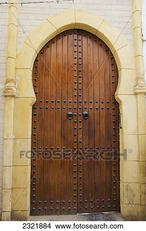 Wooden Door Decorated In Rivets In An Arch In The Old Medina; Casablanca Morocco View Large Photo Image Picture - Wooden Door Decorated In Rivets In An Arch In The Old Medina; Casablanca Morocco. Fotosearch