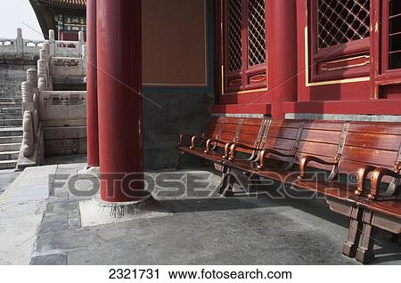Wooden Seating Outside A Building With A Red Wall And Red Pillars; Forbidden City Beijing China View Large Photo Image Stock Image - Wooden Seating Outside A Building With A Red Wall And Red Pillars; Forbidden City Beijing China. Fotosearch